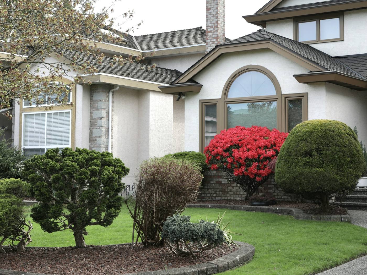 **Old Mill** · New beds and a front lawn brought back with fall aeration and overseeding.